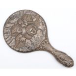 A silver hand mirror, Birmingham 1915, embossed with winged cherubs, 15.5cm