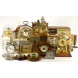 A collection of mechanical and quartz clocks, including miniature, ceramic, anniversary, mantel,