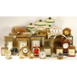 A collection of quartz and mechanical clocks, to include a John Thomas bracket clock with moon