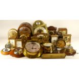 A collection of quartz and mechanical clocks, to include an Ingersoll alarm clock, a Estyma carriage