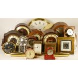 A collection of mechanical and quartz clocks, including anniversary, mantel, wall, ceramic, alarm