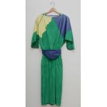 Soft leather dress, by CiBi of Sheffield and London. Mainly green suede with patches of leather,