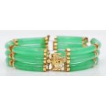A Chinese 14K gold and jadeite panel link bracelet, untested for colour enhancement, 18cm