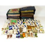 An extensive collection of cigarette and tea cards, including butterflies, British mammals, space,