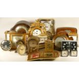A collection of mechanical and quartz clocks, including cuckoo clocks, mantel, lantern, carriage,