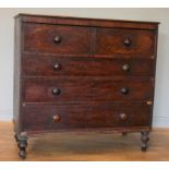 An early 19th century bureau chest of drawers, hinged full front opening to reveal two banks of four