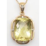 A 9ct gold citrine and diamond pendant, the multi faceted stone measuring 20 x 15mm, the frame set