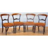 A Victorian set of four balloon back dining chairs, with button upholstered seats.