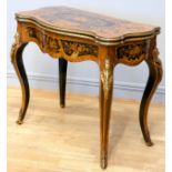 A 19th century French serpentine kingwood and mahogany fold over card table, the ebony and stained