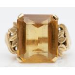 A vintage 9ct gold and citrine dress ring, date letter sized, claw set with a rectangular stone