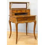 A late 19th century French burr walnut and stained fruitwood writing table, with ormolu mounts,
