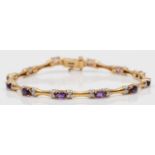 A 9ct gold amethyst and diamond line bracelet, 19cm, 9.1gm