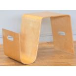 A stylised bent plywood coffee table and magazine rack combined. W63, H44, D35cm.