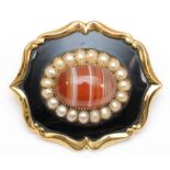 A Victorian gold, black enamel, banded agate and half pearl mourning brooch, hair locket to the