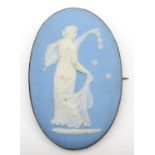 An Edwardian 9ct gold mounted Wedgwood Jasperware panel brooch, 9ct tab, depicting Flora, 70 x 46mm.