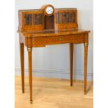 A late 19th century French tulipwood and mahogany parquetry veneered writing table, central 8 day