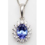 A 9ct white gold tanzanite and CZ cluster pendant,17mm overall, chain, 6.1gm