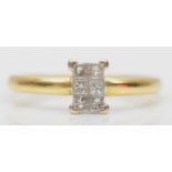 An 18ct gold six Princess cut diamond panel ring, stated weight 0.20cts, O, 2.3gm