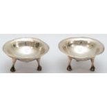 Charles Robert Ashbee, a Victorian Arts and Crafts pair of silver open dishes, London 1900, spot