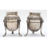 A 19th century Italian silver pair of urns, Naples 1832-72, raised on three lion mask paw legs, 8cm,