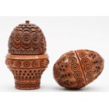 Two 19th century carved wood eggs, thimble holders or pomanders, with screw oof covers, 6.5 and 5cm