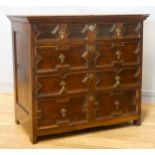 A William III oak chest of drawers, having two short drawers over three graduated long drawers,