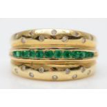 A 14K gold emerald and diamond three row ring, gypsy set with brilliant cut stones, O, 5.7gm