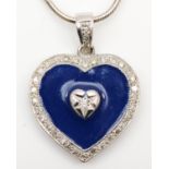 A 9ct white gold, enamel and diamond heart shape pendant, the brilliant cut stone within a blue