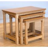 Robert 'Mouseman' Thompson, an oak nest of three tables, having adzed rectangular tops, on four