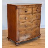 An Edwardian mahogany bow fronted chest of drawers, having two short drawers over three graduated