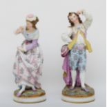 A large pair of early 20th century continental figures, probably Sitzendorf, depicting a man and
