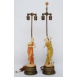 A pair of Royal Worcester gilt and blush ivory figures of Classical Maidens table lamps, modelled by