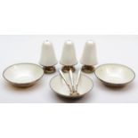 A Norwegian silver gilt and white guilloche enamel set of three salt pots, dishes and spoons, by