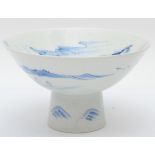 A Japanese blue and white porcelain stem cup, early 20th century, painted in overglaze enamels to