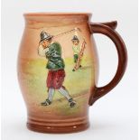 A Royal Doulton jug, depicting a golfer mid swing with a caddy, signed on base with makers mark