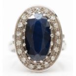 A vintage 14ct white gold sapphire and diamond cluster ring, Edinburgh 1983, 20 x 14mm, L, 7.6gm