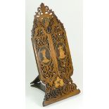 A late 19th century walnut vanity mirror, chased tri-fold panels hand carved with floral inlay