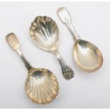A George III silver fiddle and shell pattern caddy spoon, by Thomas Robinson & S. Harding, London