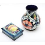 A Moorcroft trinket box, leaves and berry pattern, stamped Moorcroft potter to H.M. The Queen on