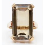 A vintage 9ct gold and smokey quartz dress ring, stamped 9ct, claw set with an emerald cut stone