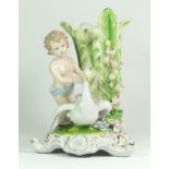 A 19th century German porcelain vase, depicting a boy standing next to a flower bud shaped vessel,