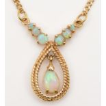 A 14K gold and opal pendant, with articulated pear shape drop, 41cm, 6.5gm