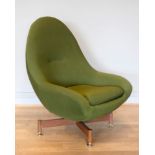 A swivel egg chair by Greaves & Thomas, c.1960s, the moulded shell, upholstered in a sage green