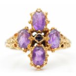 A vintage 9ct gold and amethyst dress ring, London 1977, with carved shoulders, O 1/2, 4.2gm