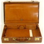 J.C. Vickery of Regent Street, London, a vintage crocodile skin brief case, opening to reveal letter