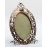 An Art Nouveau silver photograph frame, unmarked apart from maker, CR conjoined?, of oval form