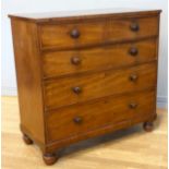 An Edwardian mahogany chest of drawers, having two short over three long drawers, raised on bun