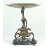 A bronze tazza, the tripod base of sphinxes with climbing snake on a central baluster upright,