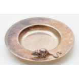 A silver circular pin dish, by Sarah Jones, London 1986, with applied mouse, 34gm, 6.5cm https://