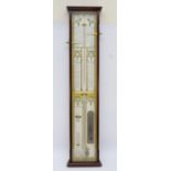 A mahogany cased Admiral Fitzroy barometer, having architectural pediment with brass central finial,